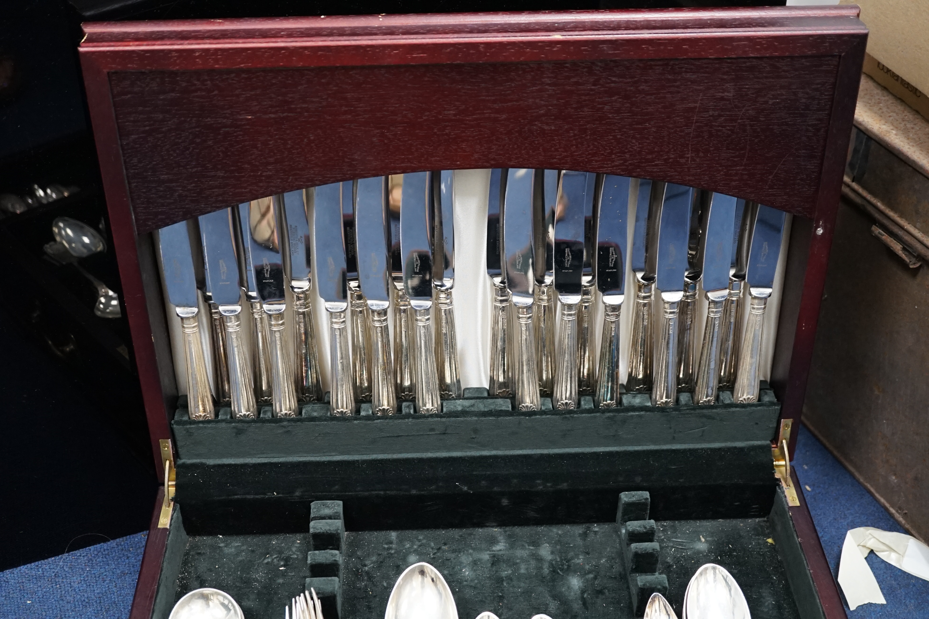 A matched part canteen of modern silver fiddle, thread and shell pattern cutlery, by Roberts & Belk and Cooper Brothers & Sons